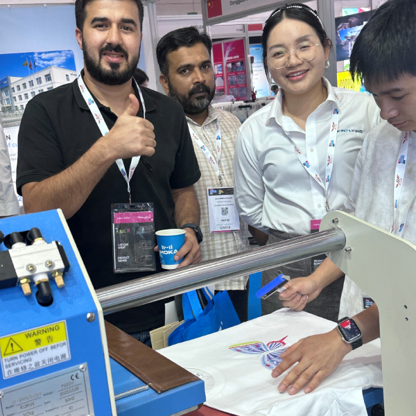 Our expert team demonstrating high-performance DTF printing solutions at the exhibition floor.